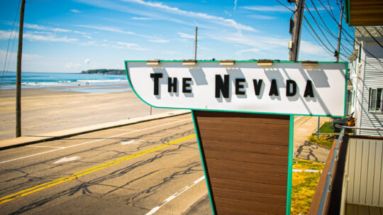 Photo of The Nevada sign with the beach in the background