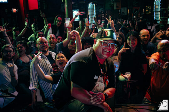 DJ in front of crowd of people