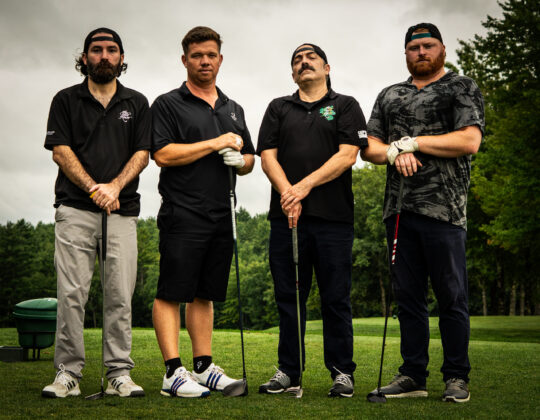 4 guys in golf attire