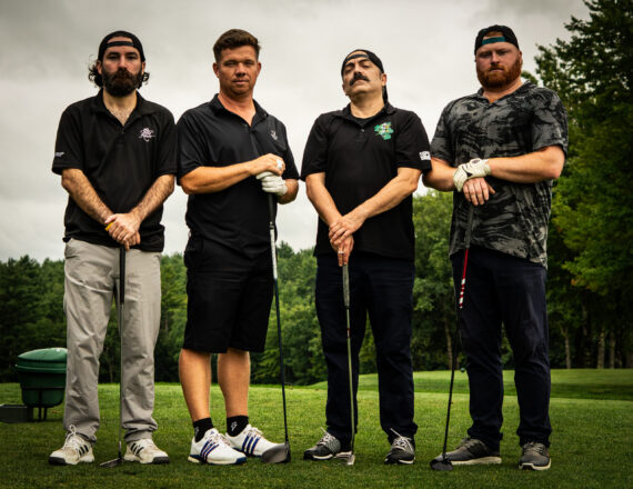 4 guys in golf attire