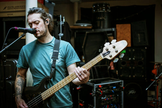 Bass guitar player playing a 